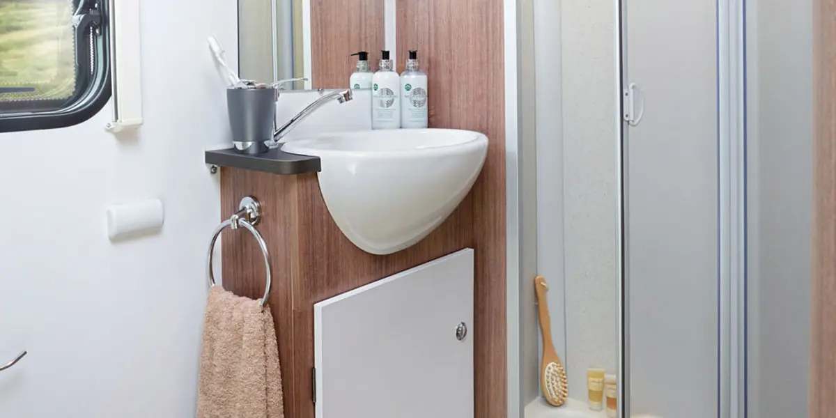 Advance 76-4 bathroom with ‘Granite Stone’ finish fully lined shower cubicle