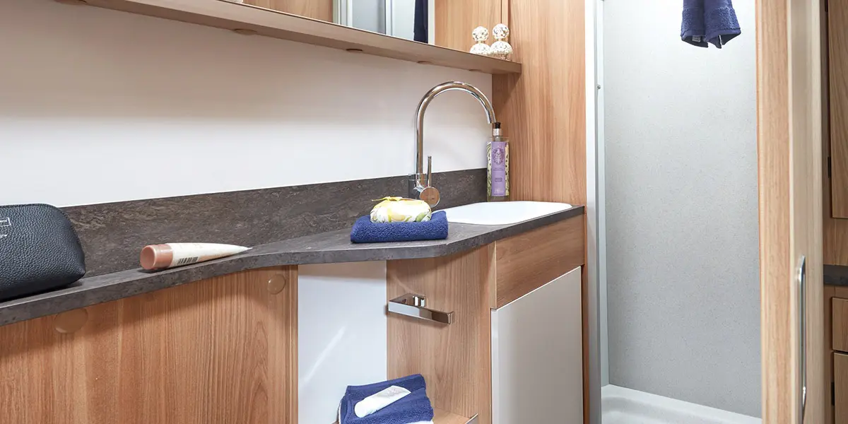 Alicanto Grande Sintra bathroom with large ʻGranite Stoneʼ fully lined square shower cubicle with bi-fold partition door and integral lighting