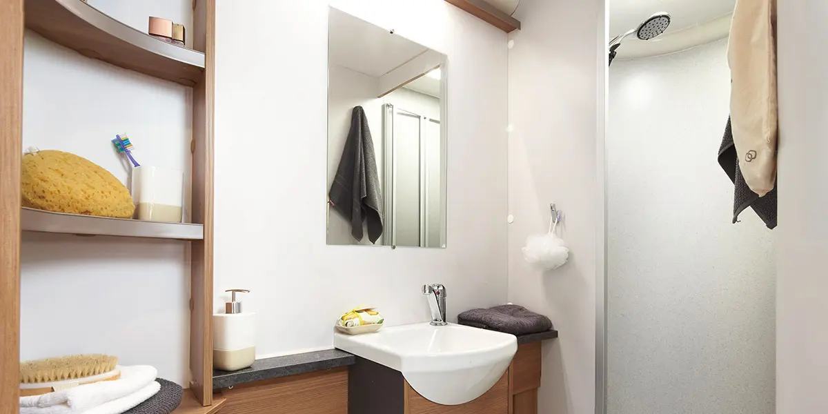 Discovery-D4-4 bathroom with Granite Stone fully lined shower cubicle and bi-fold partition door