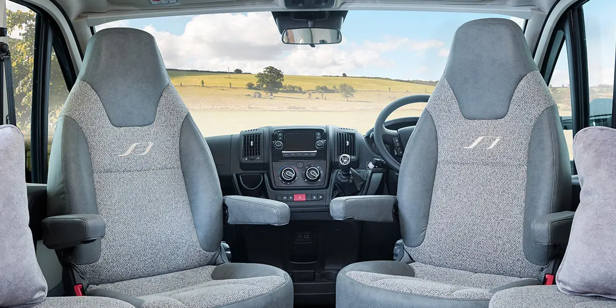 Fully adjustable driver and passenger seats with twin upholstered armrests in optional ‘Portobello’