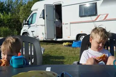 Andy's children sitting outside their motorhome