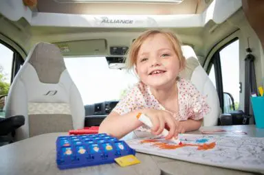 Young girl enjoying a UK staycation in her family motorhome