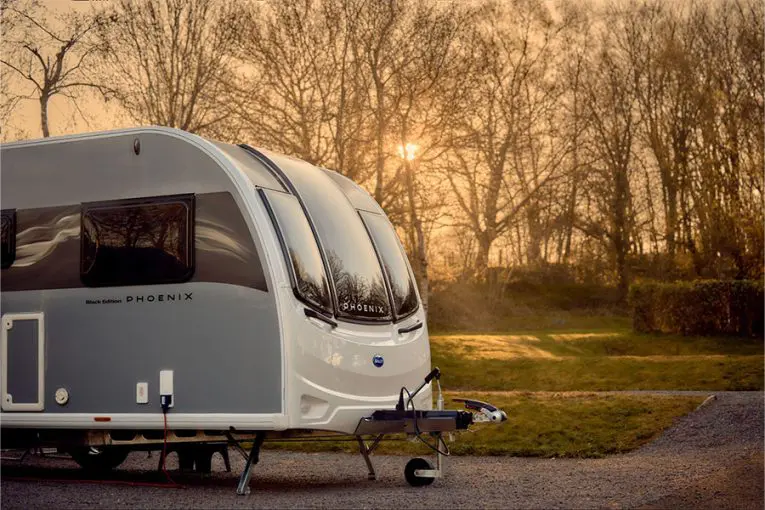 A Bailey Phoenix Black Edition at sunset on a campsite