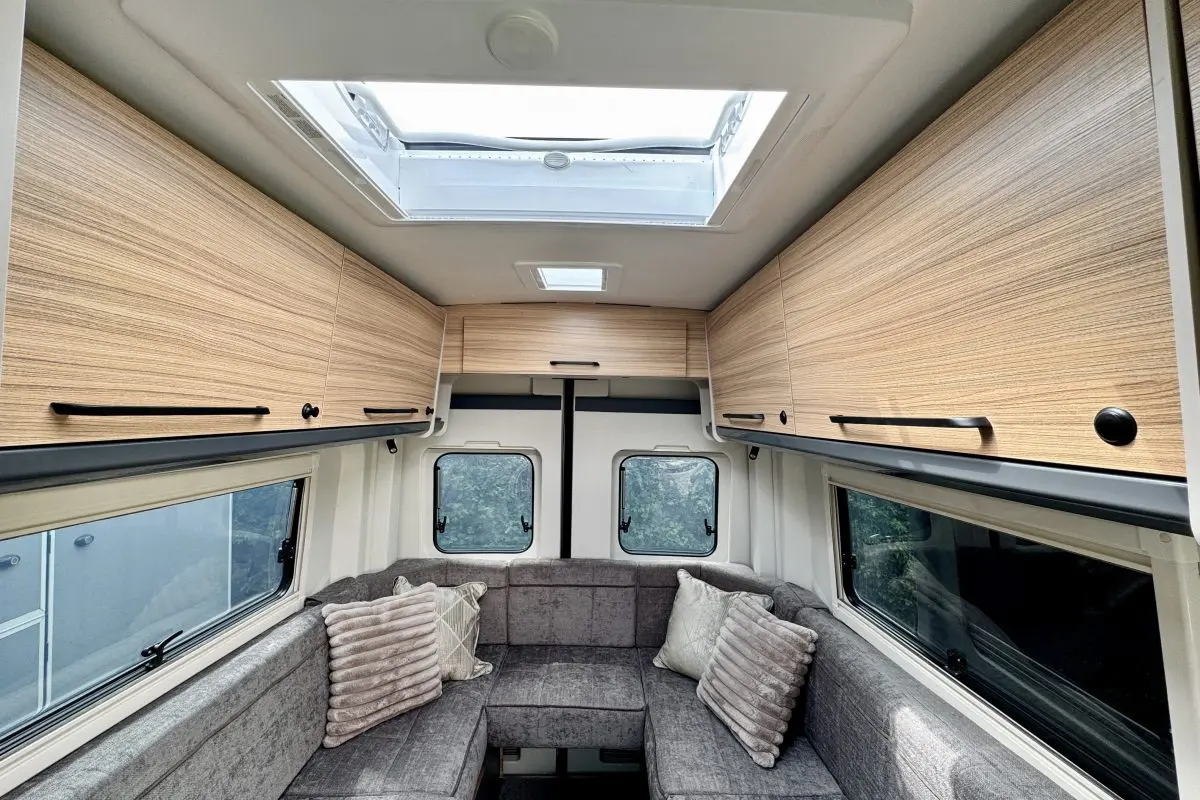 Interior lounge of the Bailey Endeavour B62 with twin sofas, overhead lockers and rooflight.