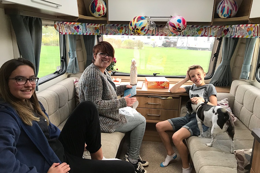 Family in caravan lounge