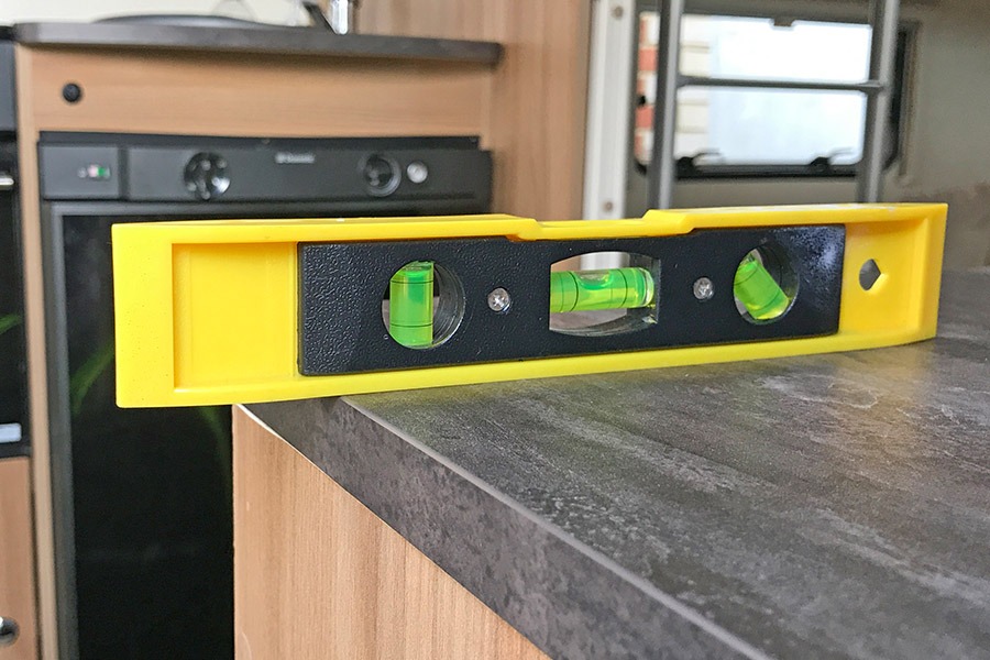 Using a spirit level to help level the caravan