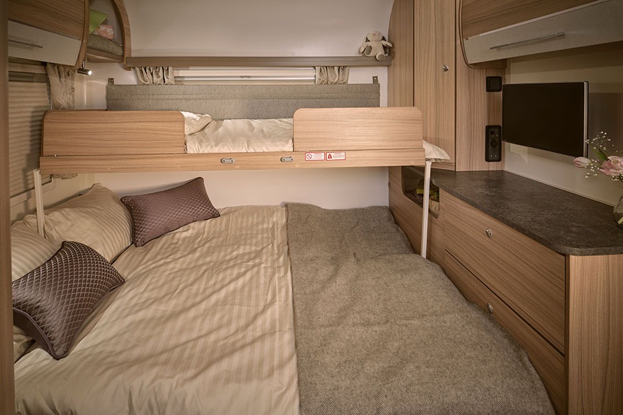 Rear bedroom featuring fold-out bunk