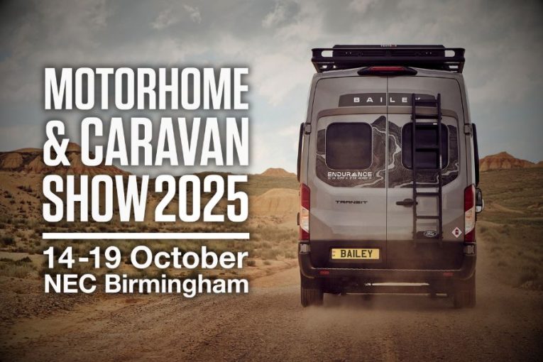 Rear view of the Bailey Endurance campervan on a rugged track with “Motorhome & Caravan Show 2025, 14–19 October, NEC Birmingham” text overlay.