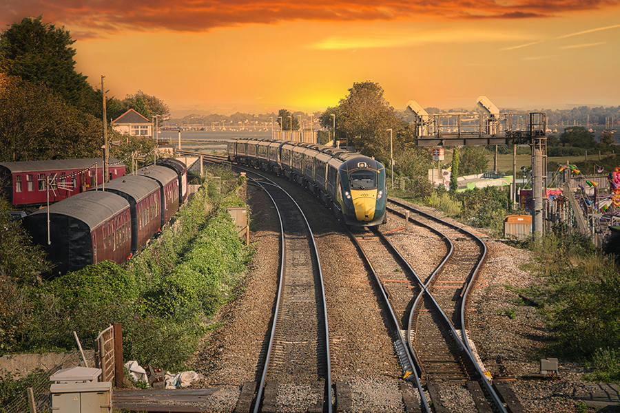 A train pulling into Dawlish at sunset. Photo by Zach Pickering on Unsplash