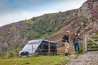 A couple beginning a hike next to their Bailey Endeavour