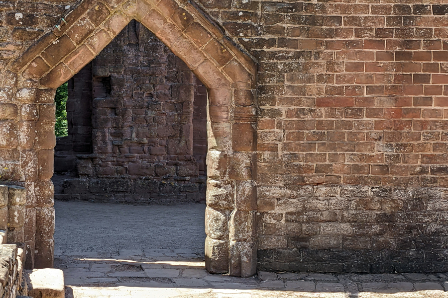 A doorway into Skenfrith Castle. Photo by Philippa Lowe on Unsplash