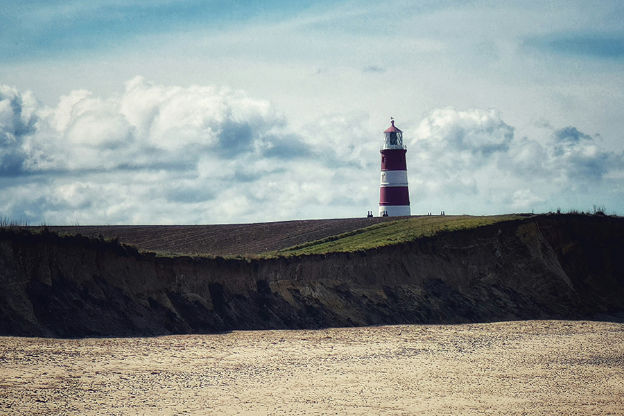 A lighthouse keeping watch over the Norfolk Coast. Photo by Chris Spalton on Unsplash