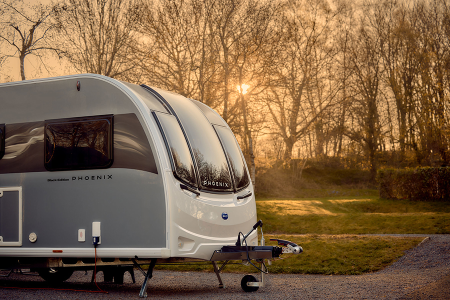 A Bailey Phoenix Black Edition on a campsite at dusk