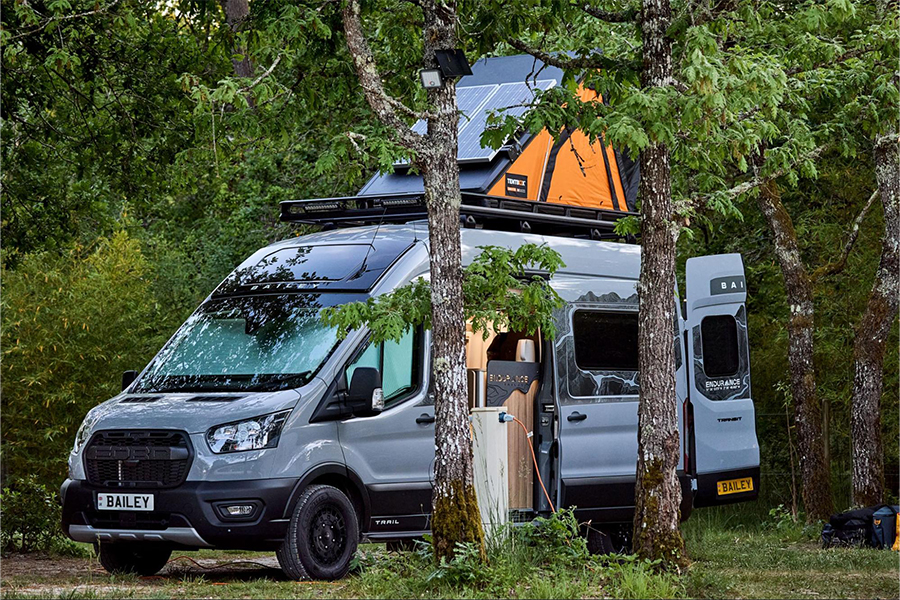 A Bailey of Bristol Endurance campervan pitched in a forest