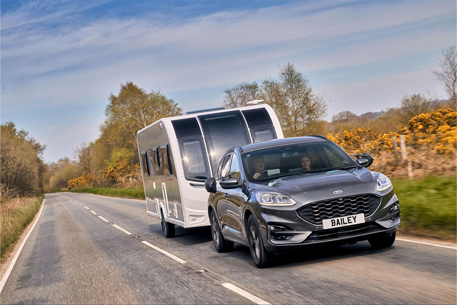 A Bailey of Bristol Phoenix Black Edition being towed along a UK road