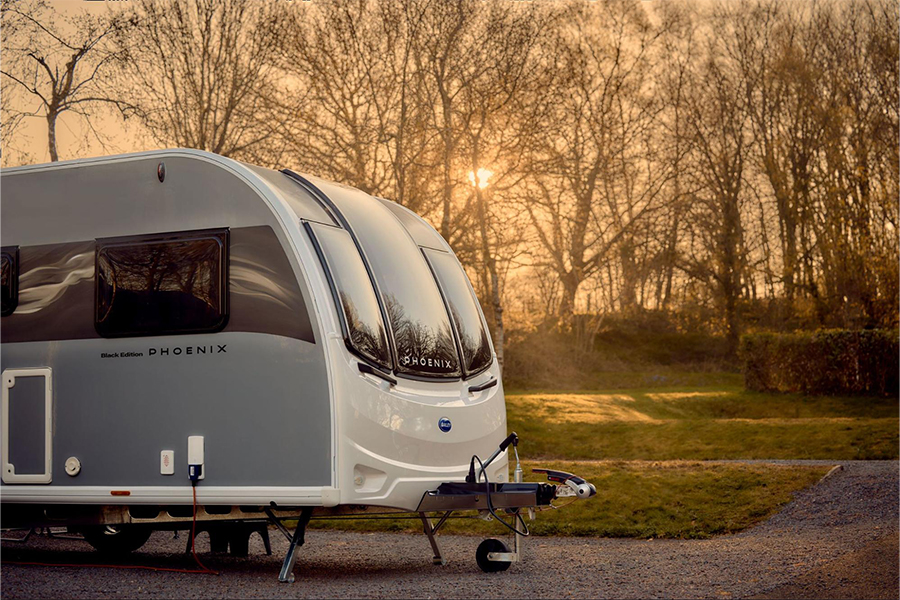 A Bailey Phoenix Black Edition at sunset on a campsite
